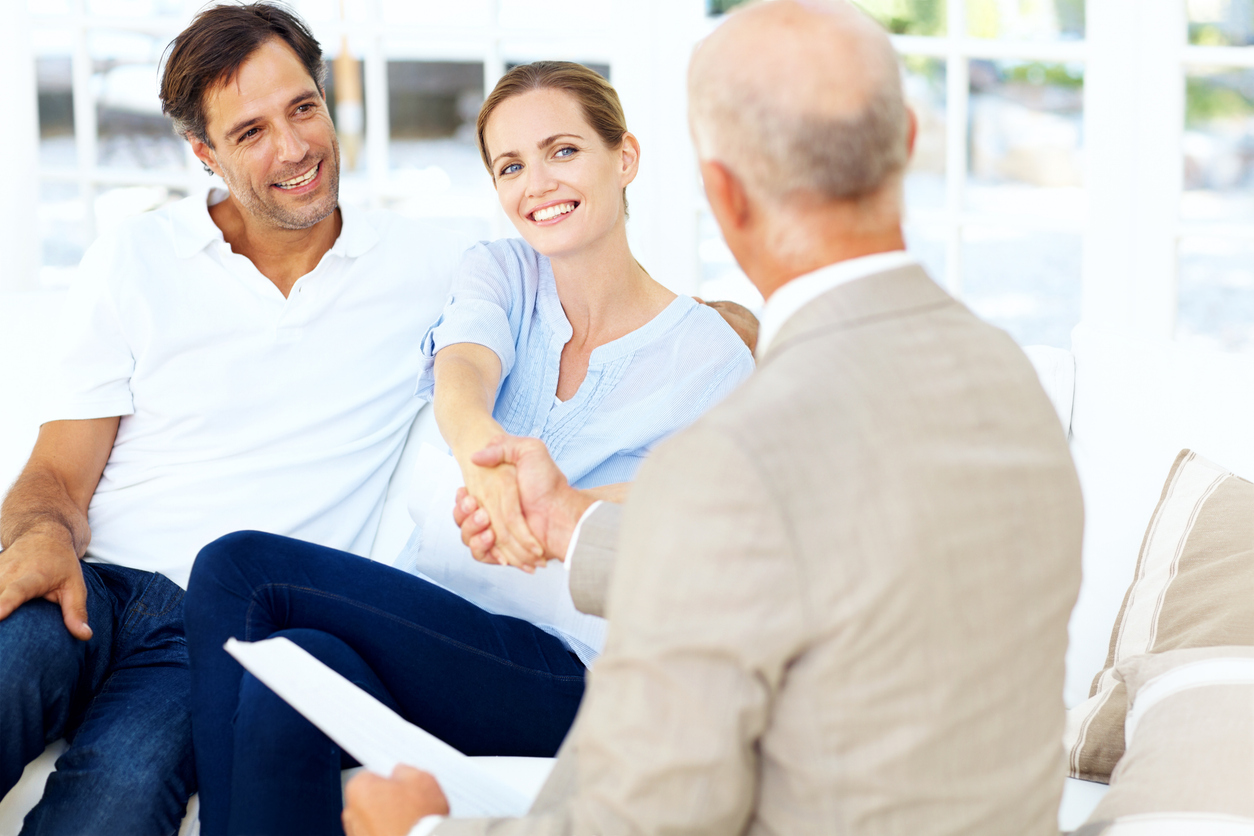 young couple consulting local agent